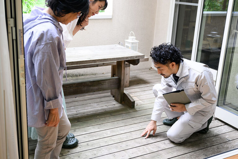 licensed inspector conducting SB721 Inspection on a deck